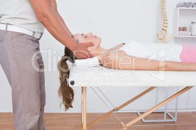 Woman receiving neck massage