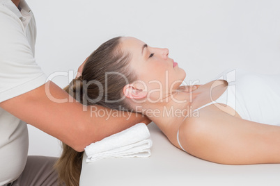 Woman receiving neck massage