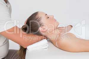 Woman receiving neck massage