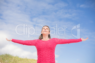 Smiling woman wearing a lovely pink top