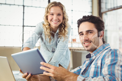 Portrait of business people working at office