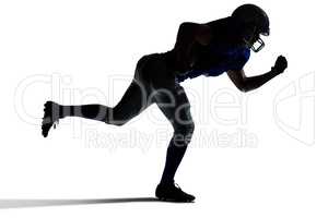 Silhouette American football player running