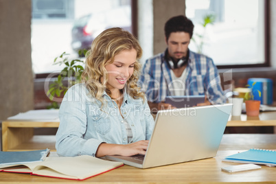 Joyful business woman working in office