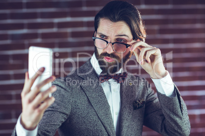 Stylish man taking picture of himself