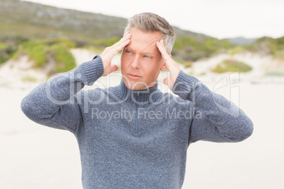 Man massaging his temples