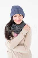 Attractive brunette looking at camera wearing warm clothes