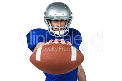 American football player holding ball