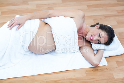 Happy pregnant woman relaxing at home