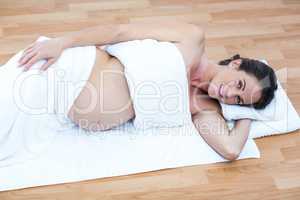 Happy pregnant woman relaxing at home