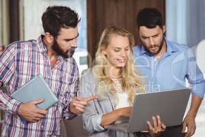 Man pointing towards laptop