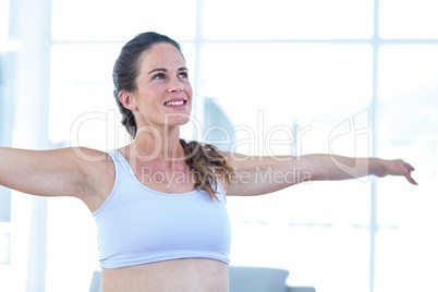 Beautiful pregnant woman performing yoga