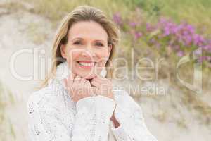 Woman smiling near the sandy hill
