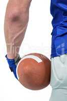 Midsection of sport person holding ball
