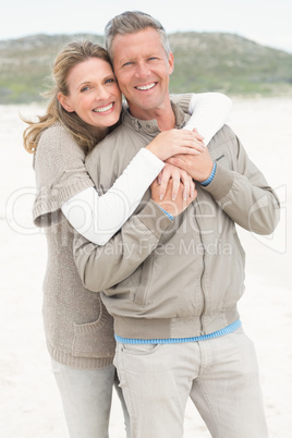Smiling couple holding one another
