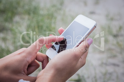 Beautiful woman using her smartphone