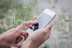 Beautiful woman using her smartphone