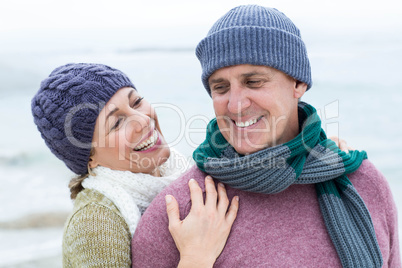 Smiling happy couple hugging each other Smiling happy couple hugging each other
