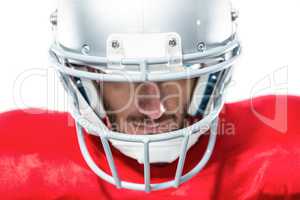 Close-up of American football player in red jersey looking down