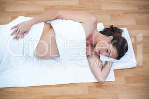 Pregnant woman sleeping at home