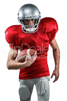 Portrait of American football player in red jersey running with