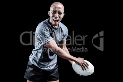 Portrait of aggressive sportsman playing rugby
