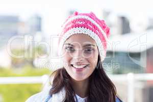 Beautiful woman looking at camera wearing woolly hat