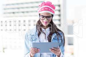 Pretty woman using her tablet pc