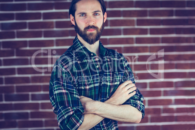 Portrait of serious confident man with arms crossed