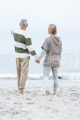 Woman holding a mans hand