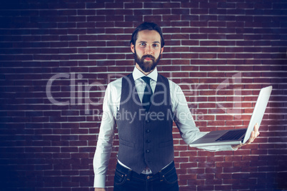 Portrait of smart man holding laptop