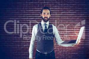 Portrait of smart man holding laptop