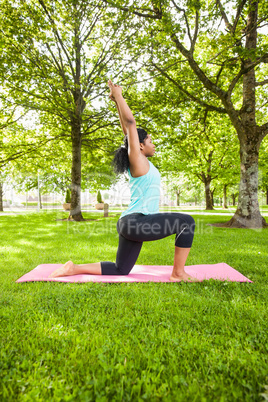 Young woman doing yoga on mat