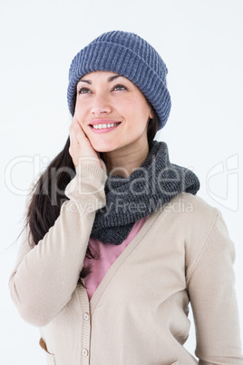 Attractive brunette looking up wearing warm clothes