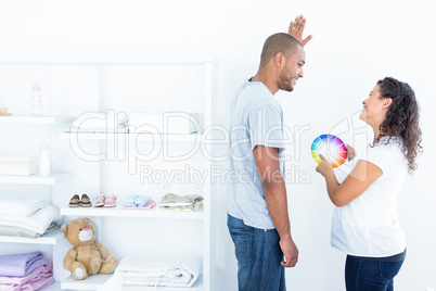 Couple choosing color for a room