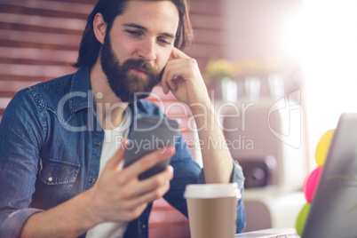 Smart businessman using cellphone