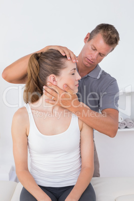 Doctor doing neck adjustment