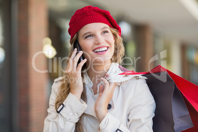 A smiling woman calling