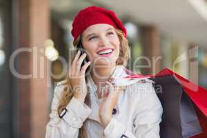 A smiling woman calling