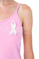 Woman wearing pink ribbon for breast cancer awareness