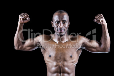 Portrait of muscular athlete posing