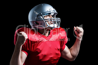 American football player cheering with clenched fist