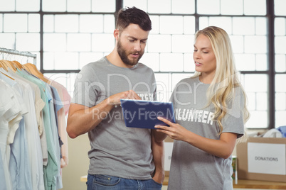 Volunteers using digital tablet