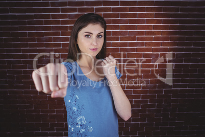 Pretty brunette punching to camera