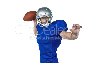 American football player throwing ball