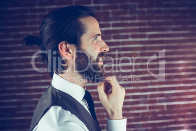 Side view of smiling man with hand on chin