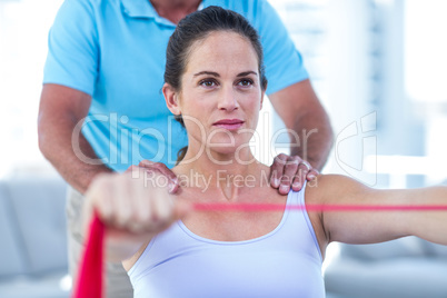 Pregnant woman stretching exercise band