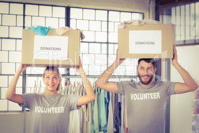 Volunteers carrying donation boxes on head