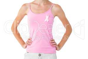 Woman wearing pink ribbon for breast cancer awareness