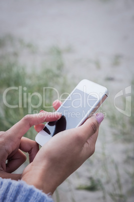 Beautiful woman using her smartphone