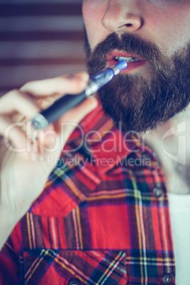 Man holding electronic cigarette